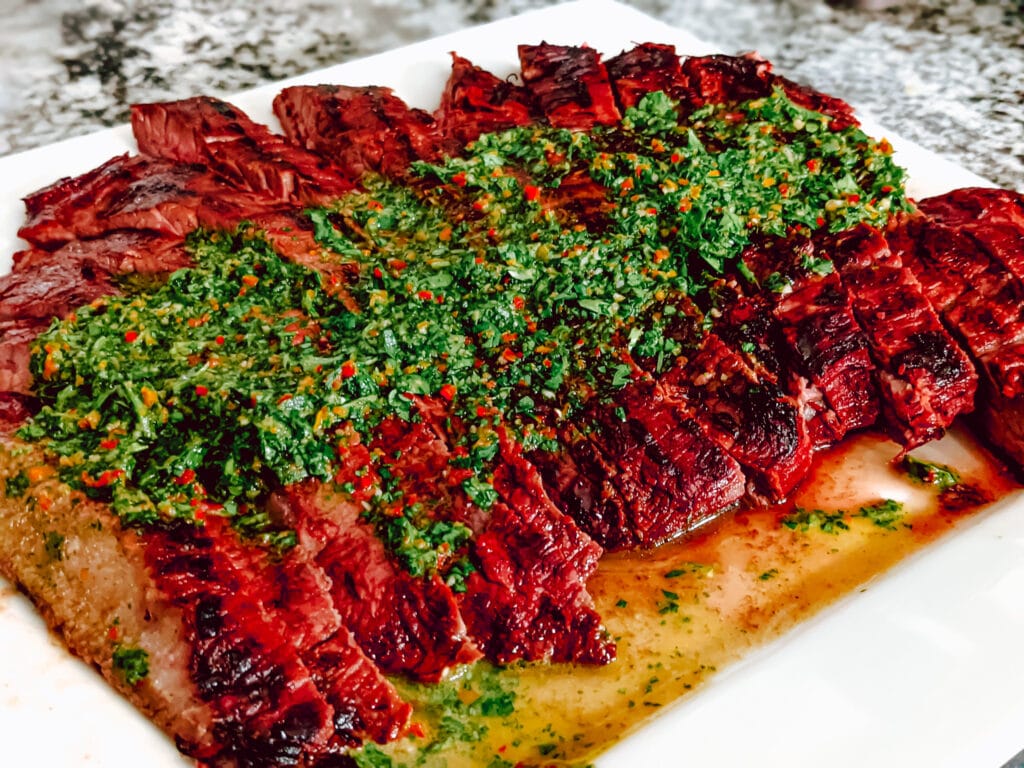 Chimichurri Sauce on top of grilled flank steak.