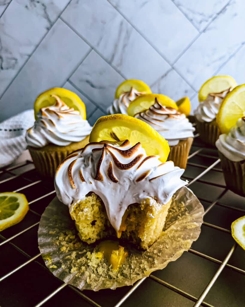 Lemon meringue cupcake with a bit missing