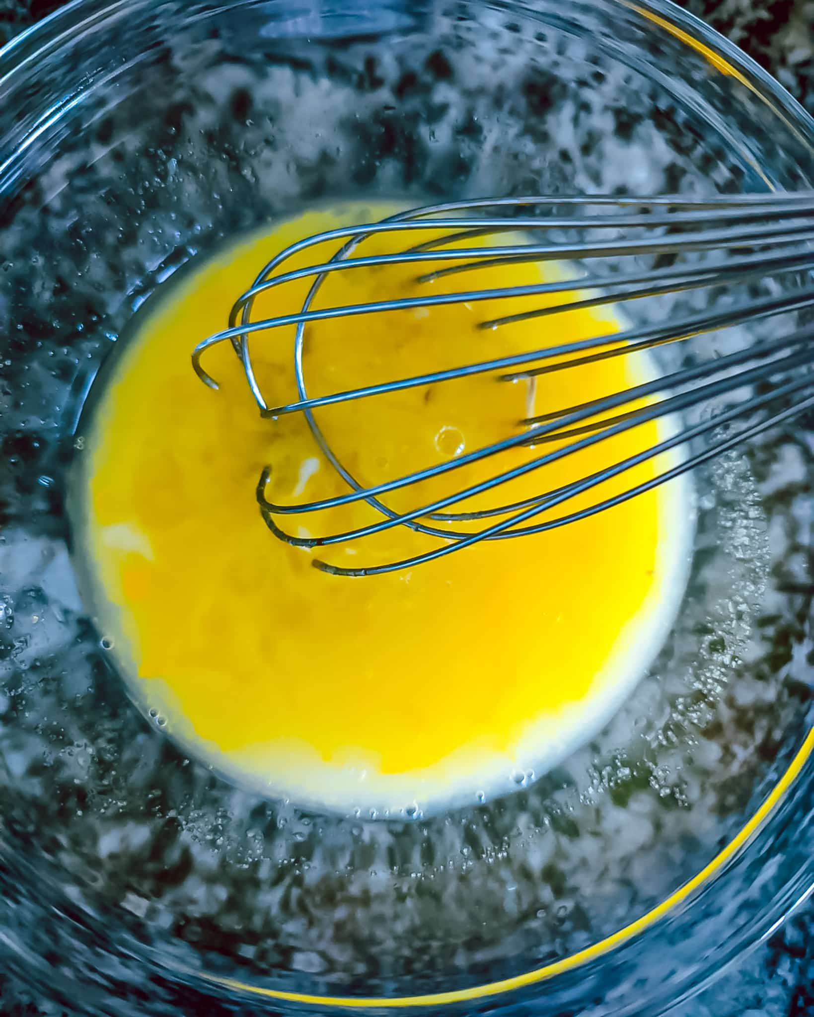Showing eggs, sugar, and lemon mixing